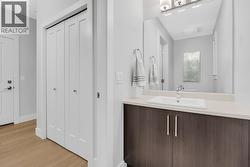 Main floor bathroom / front door closet -