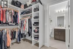Primary bedroom walk-in closet -