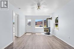 Living Room with gas fireplace and large windows -