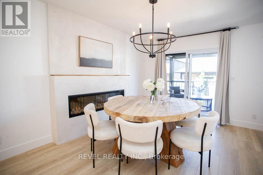 26 Gibbons Street, Norfolk, ON - Indoor Photo Showing Dining Room With Fireplace