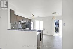 Tiled Kitchen w/lots of natural light. -