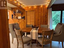 Warm wood panelling accents the combined spaces -