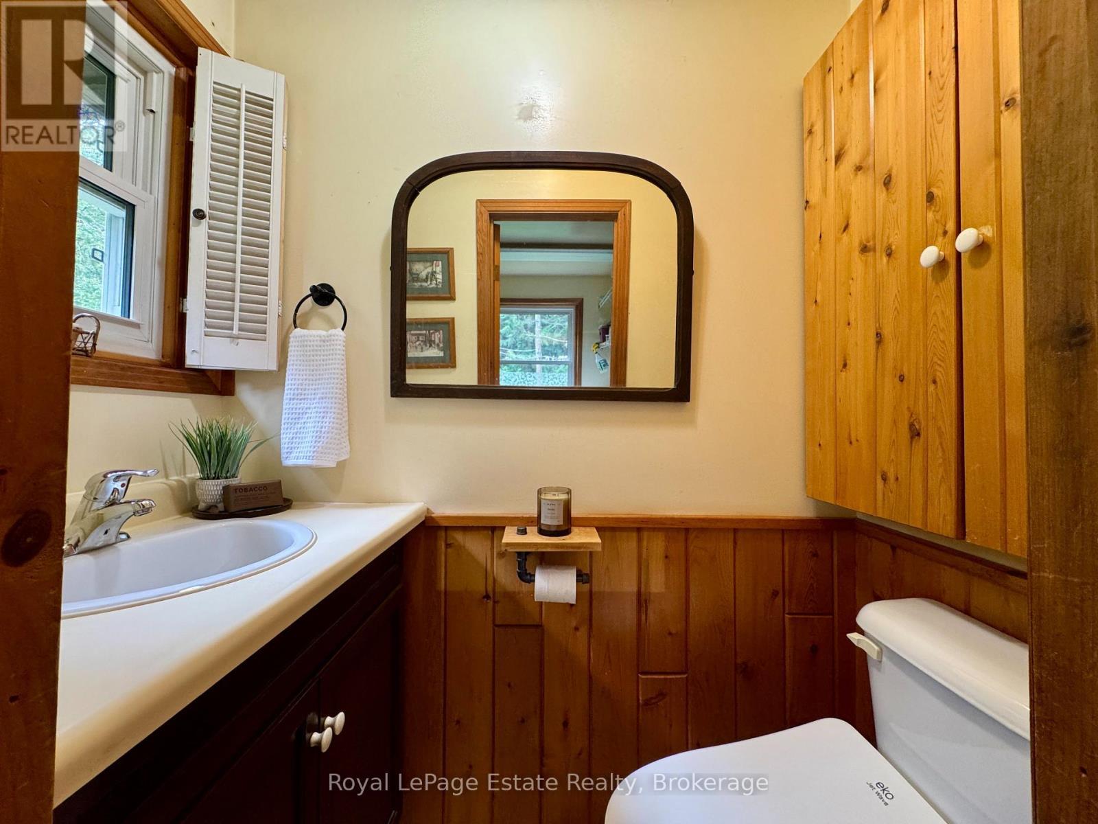 The main floor has 2 pc powder rm + EKO Jet bidet - 44 Whitefish Boulevard, South Bruce Peninsula, ON - Indoor Photo Showing Bathroom