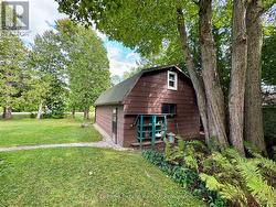 The detached garage has a loft with window -