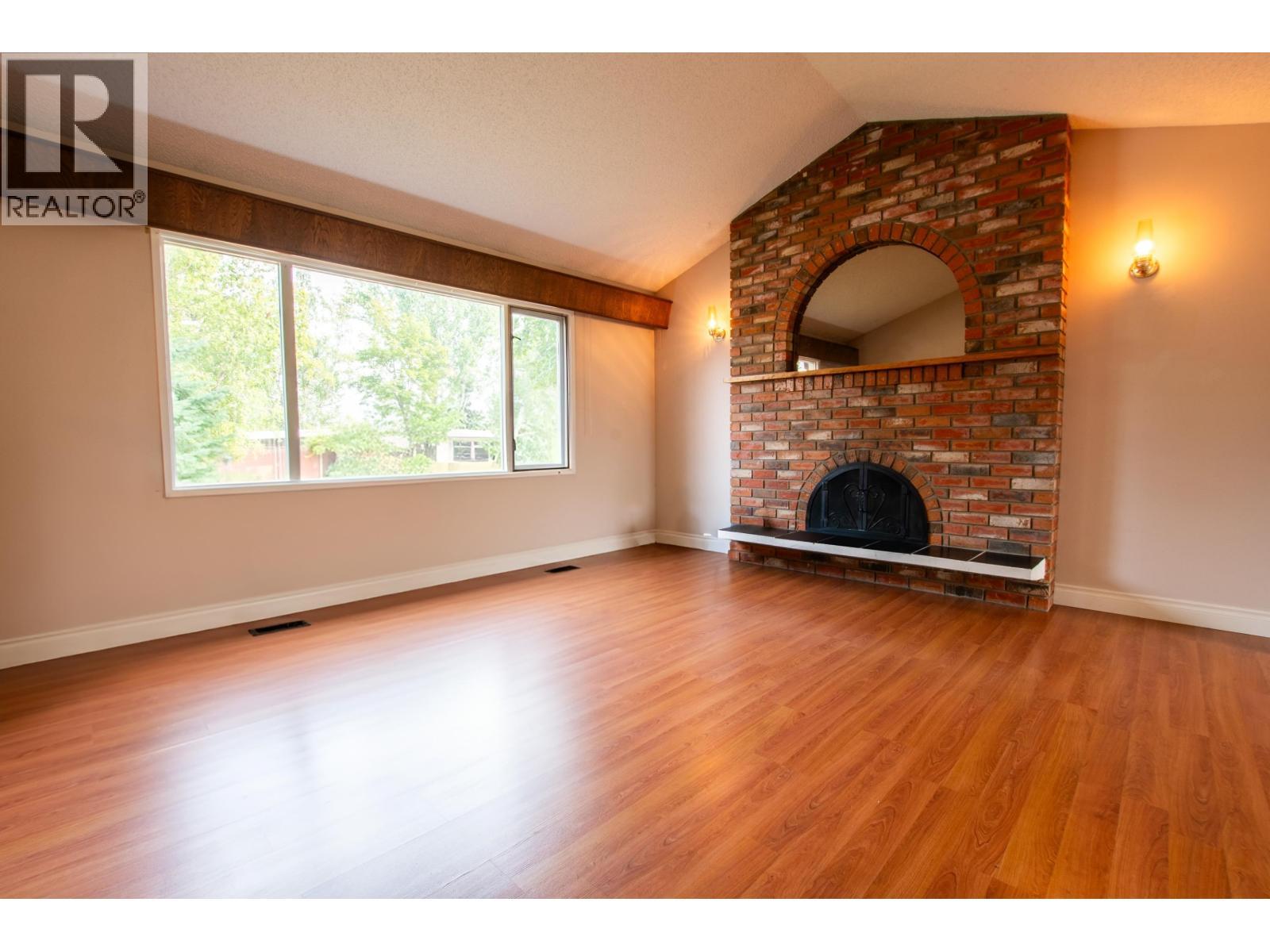 2438 Mcbride Crescent, Prince George, BC - Indoor Photo Showing Living Room With Fireplace