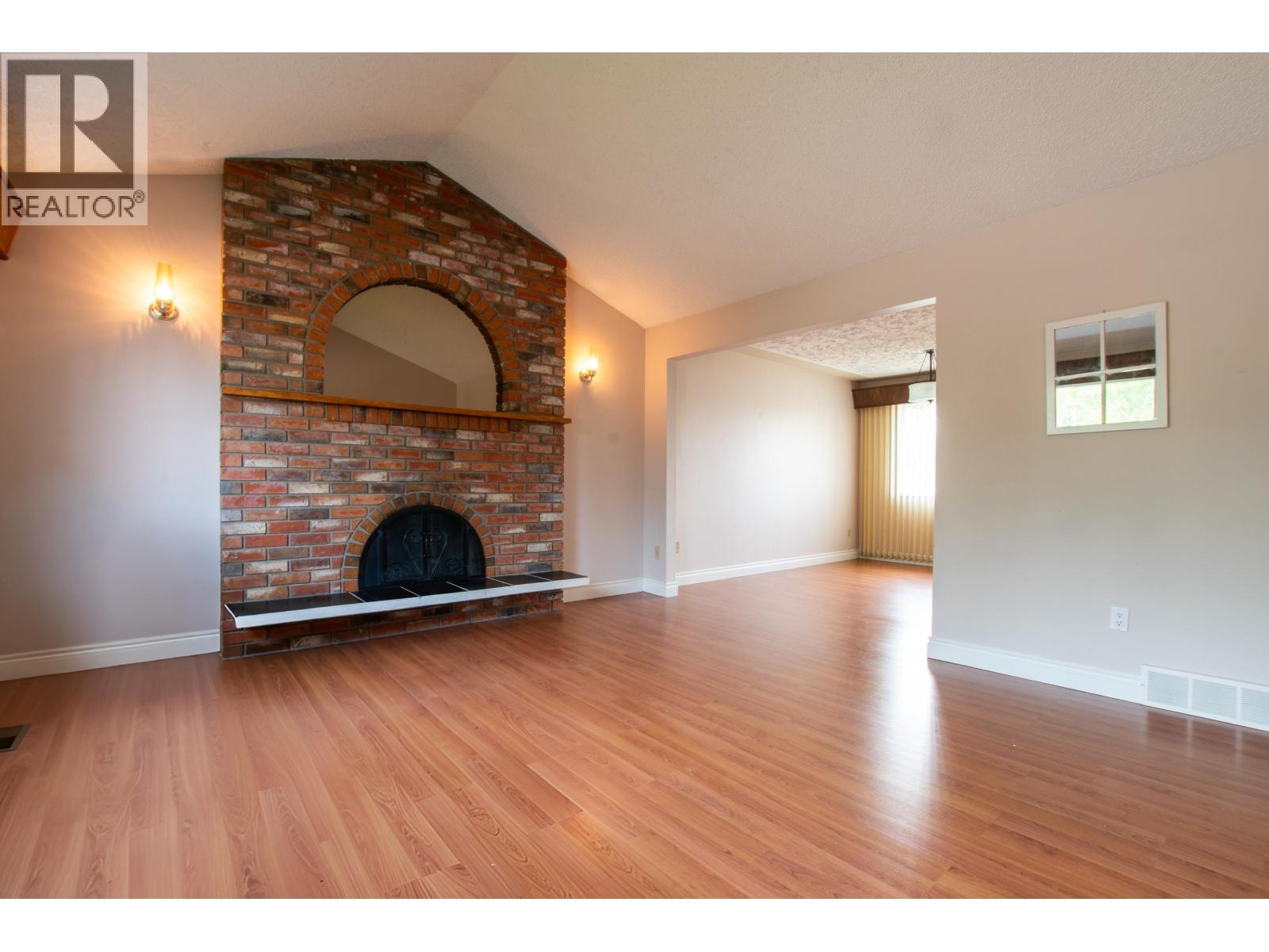 2438 Mcbride Crescent, Prince George, BC - Indoor Photo Showing Living Room With Fireplace