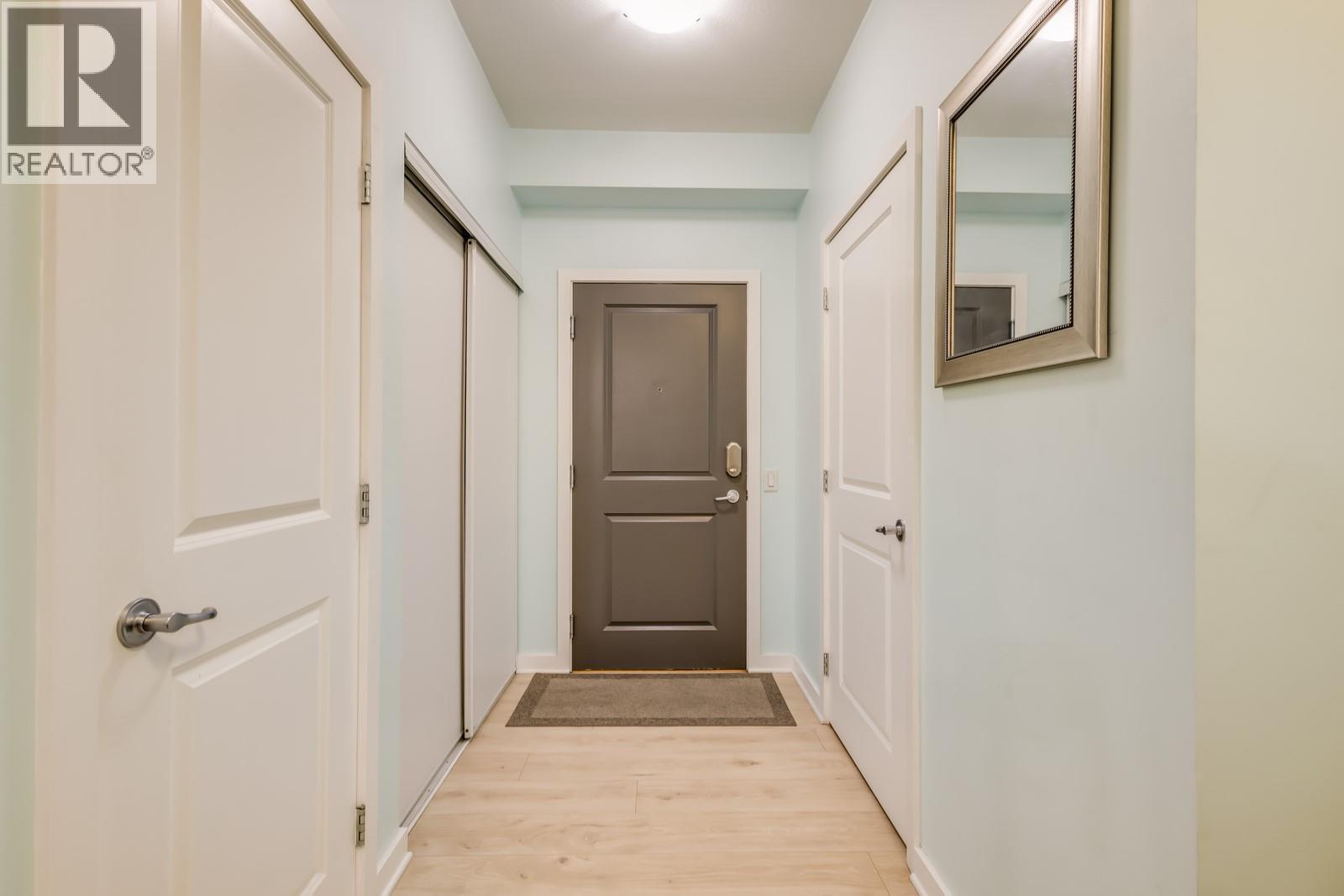 Two bedrooms down the hall - 151 Taylor Road Unit# 202, Kelowna, BC - Indoor Photo Showing Other Room