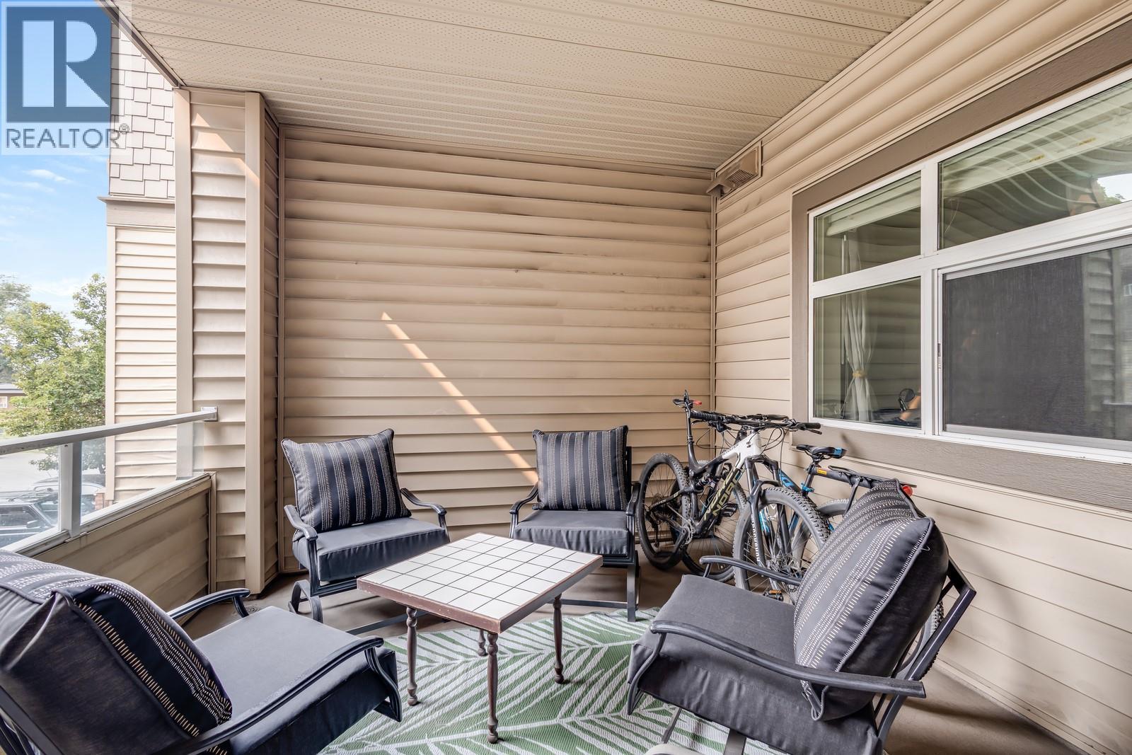 Kick back after a long day, all year long! - 151 Taylor Road Unit# 202, Kelowna, BC - Outdoor With Deck Patio Veranda With Exterior