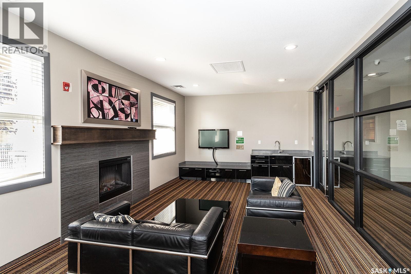 208B 415 Hunter Road, Saskatoon, SK - Indoor With Fireplace