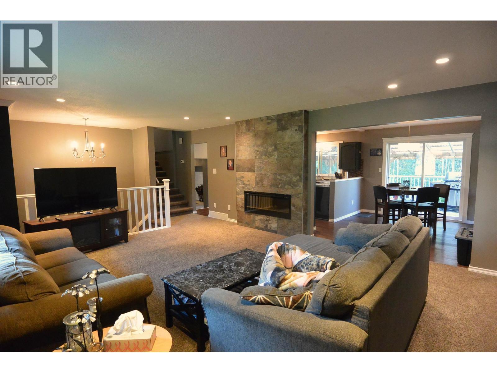3020 Nadina Way, Houston, BC - Indoor Photo Showing Living Room With Fireplace