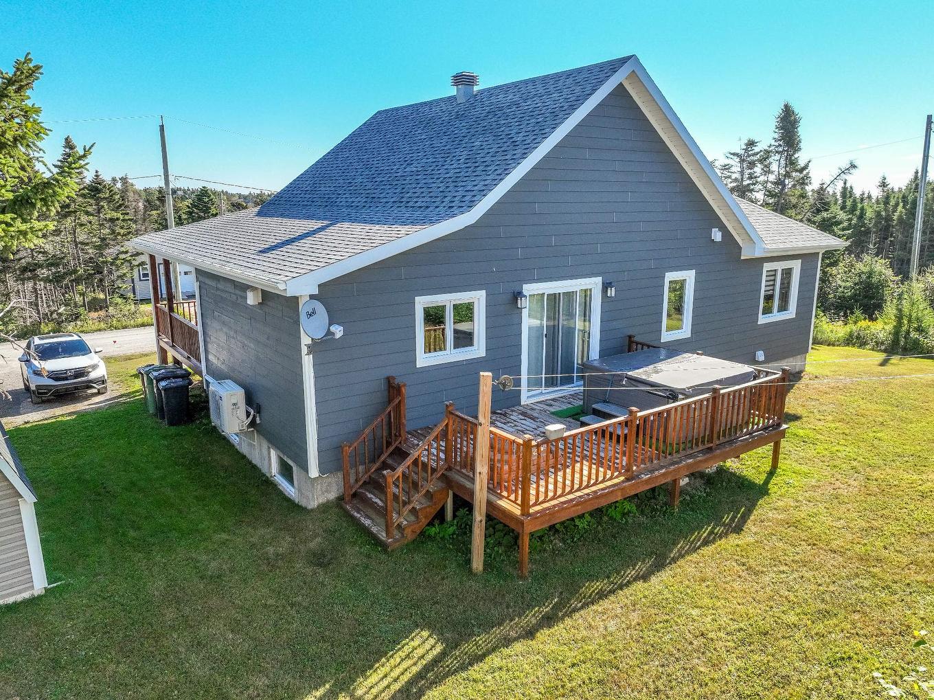 Back facade - 21 Allée Du Versant, Les Îles-De-La-Madeleine, QC - Outdoor With Deck Patio Veranda With Exterior