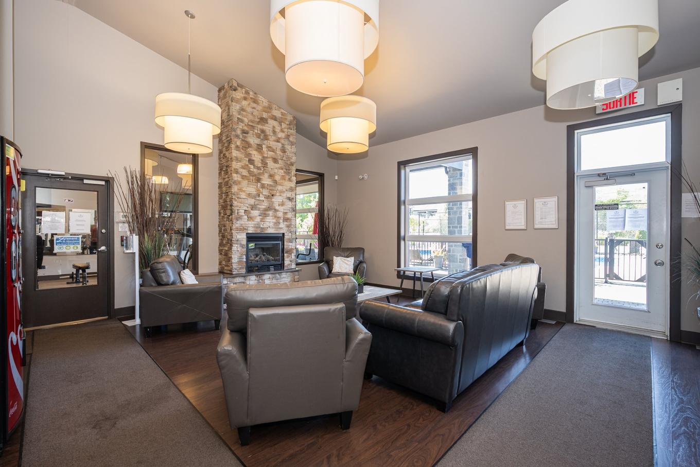 Salle communautaire - 304-5241 Av. Eliot, Laval (Chomedey), QC - Indoor With Fireplace