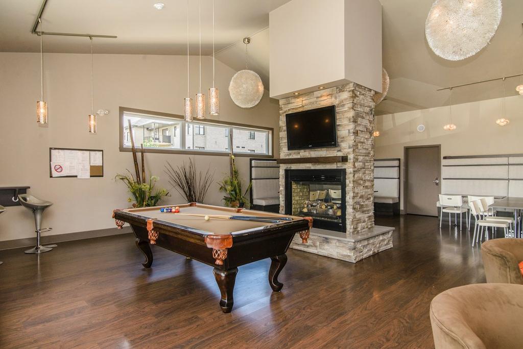 Salle communautaire - 304-5241 Av. Eliot, Laval (Chomedey), QC - Indoor Photo Showing Other Room With Fireplace