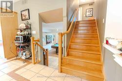 Stairs to upstairs and lower level -