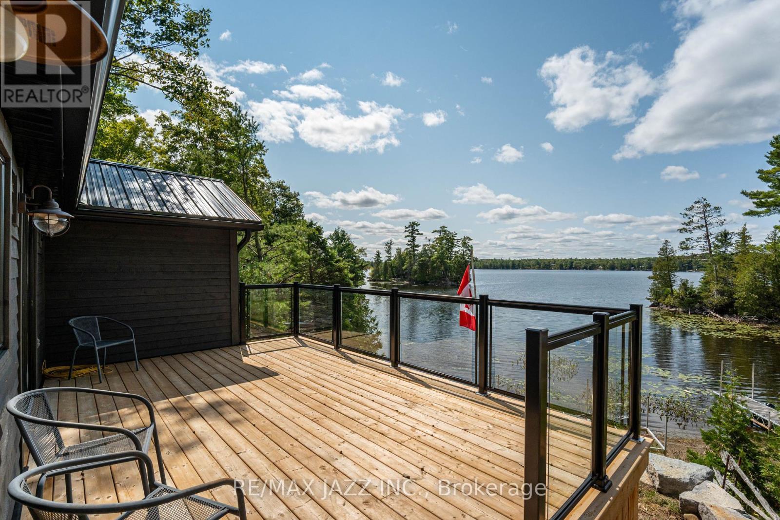 All new deck 12 by 19 ft. glass railing. - 348 Fire Rte 54, Havelock-Belmont-Methuen (Belmont-Methuen), ON - Outdoor With Body Of Water With Deck Patio Veranda With View