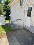Side entrance and stairs to rear of house -