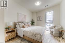 Bedroom with light wood-style floors -