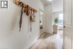 Corridor with light wood finished floors and baseboards -