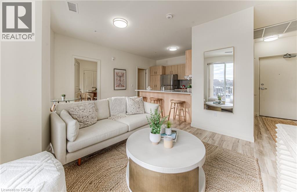 Living room with light wood-style flooring - 301 Westmount Road W Unit# 205, Kitchener, ON - Indoor Photo Showing Living Room
