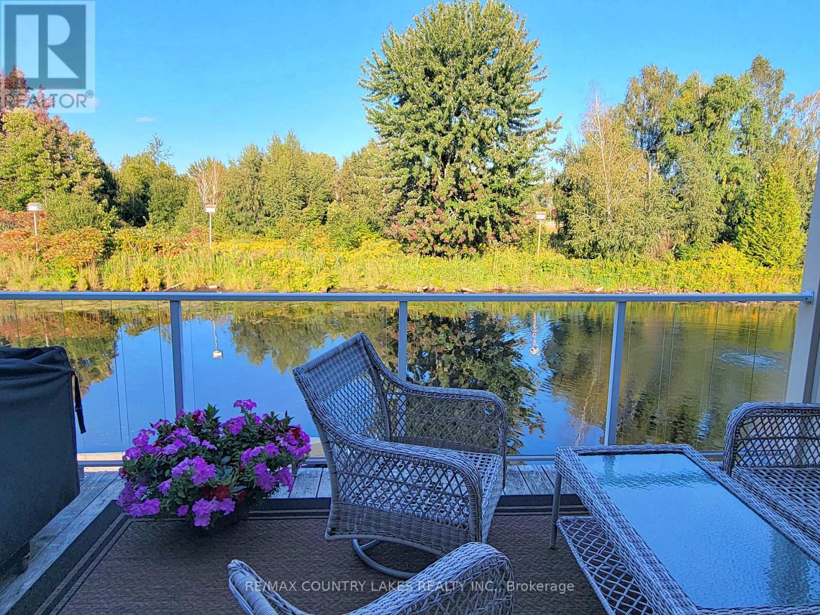 11 - 4 Paradise Boulevard, Ramara, ON - Outdoor With Body Of Water With Deck Patio Veranda