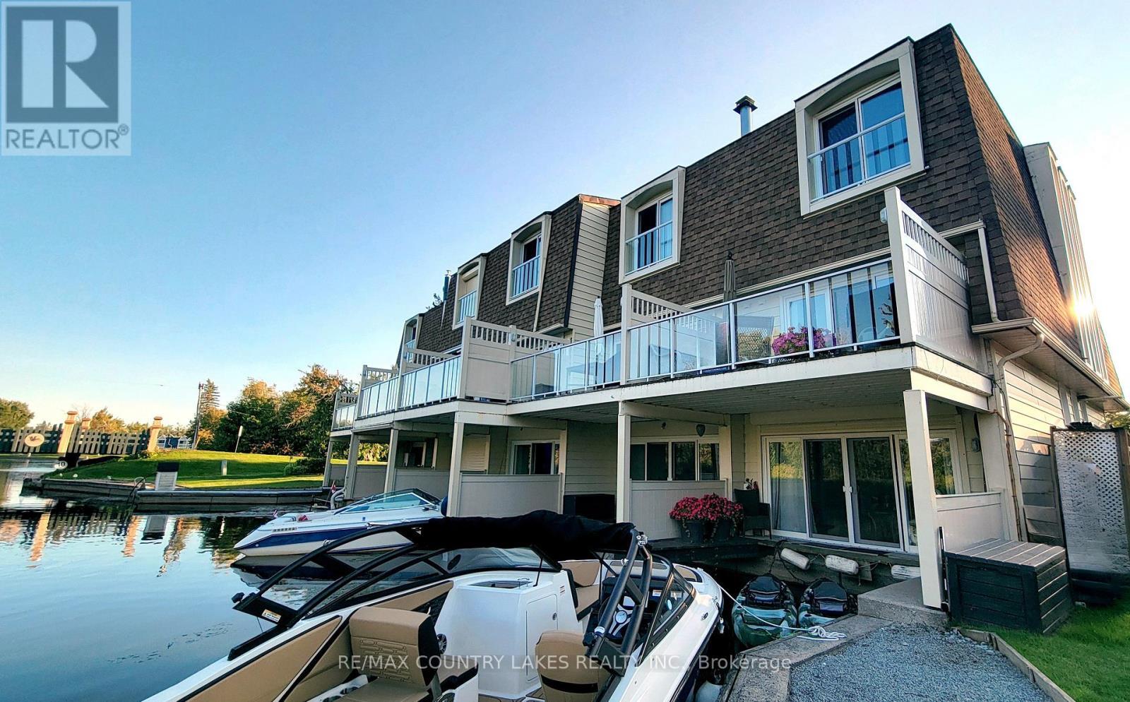 11 - 4 Paradise Boulevard, Ramara, ON - Outdoor With Body Of Water With Deck Patio Veranda