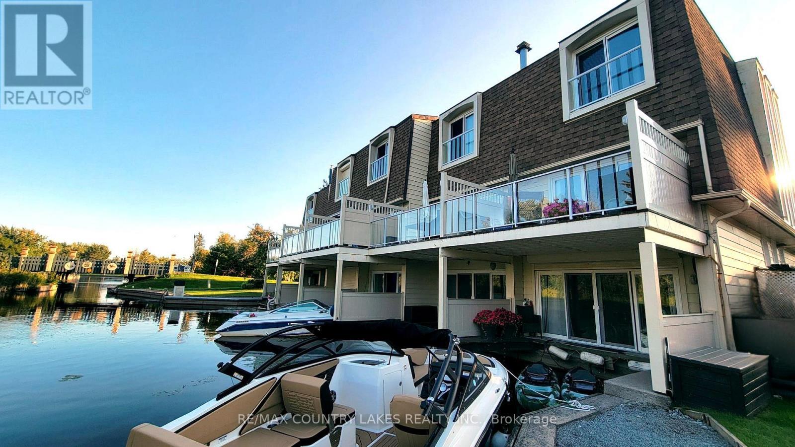 11 - 4 Paradise Boulevard, Ramara, ON - Outdoor With Body Of Water With Deck Patio Veranda