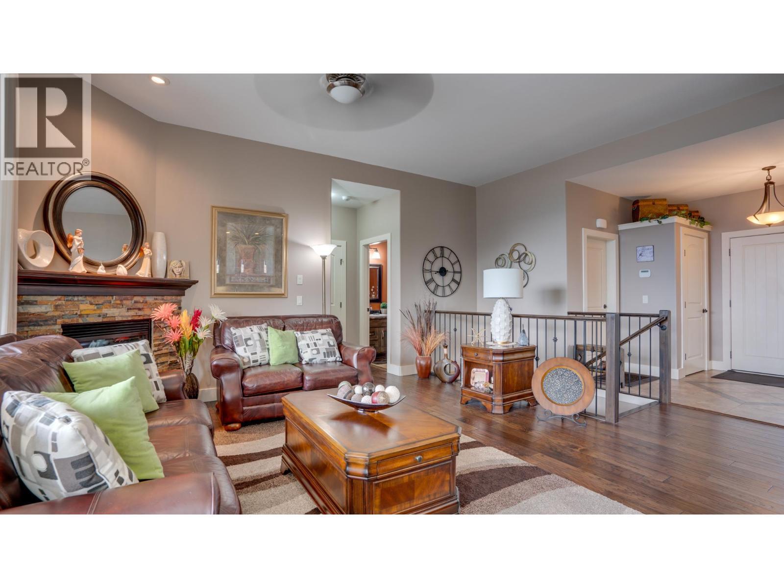 Living room - 1404 Copper Mountain Court Unit# 13, Vernon, BC - Indoor Photo Showing Living Room With Fireplace