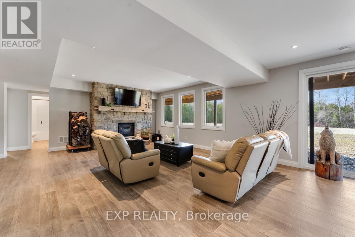 Fabulous Additional Living Space - 1023 Concession Road 8 Road, Brock, ON - Indoor Photo Showing Living Room With Fireplace