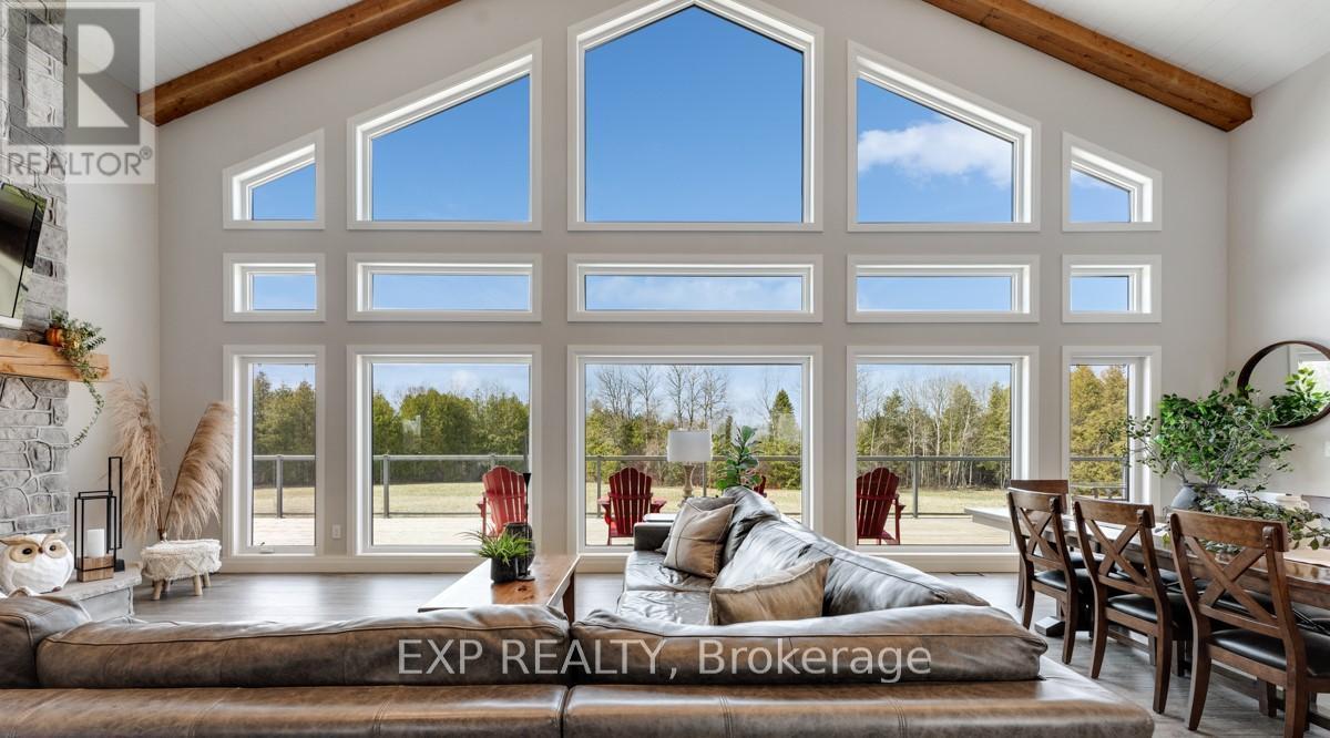 Stunning West View! - 1023 Concession Road 8 Road, Brock, ON - Indoor Photo Showing Living Room With Fireplace