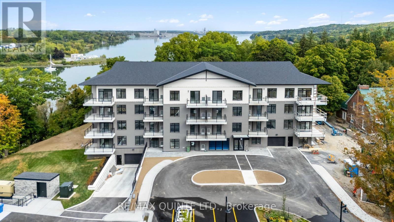 202 - 12 Clara Drive, Prince Edward County (Picton Ward), ON - Outdoor With Balcony With Facade