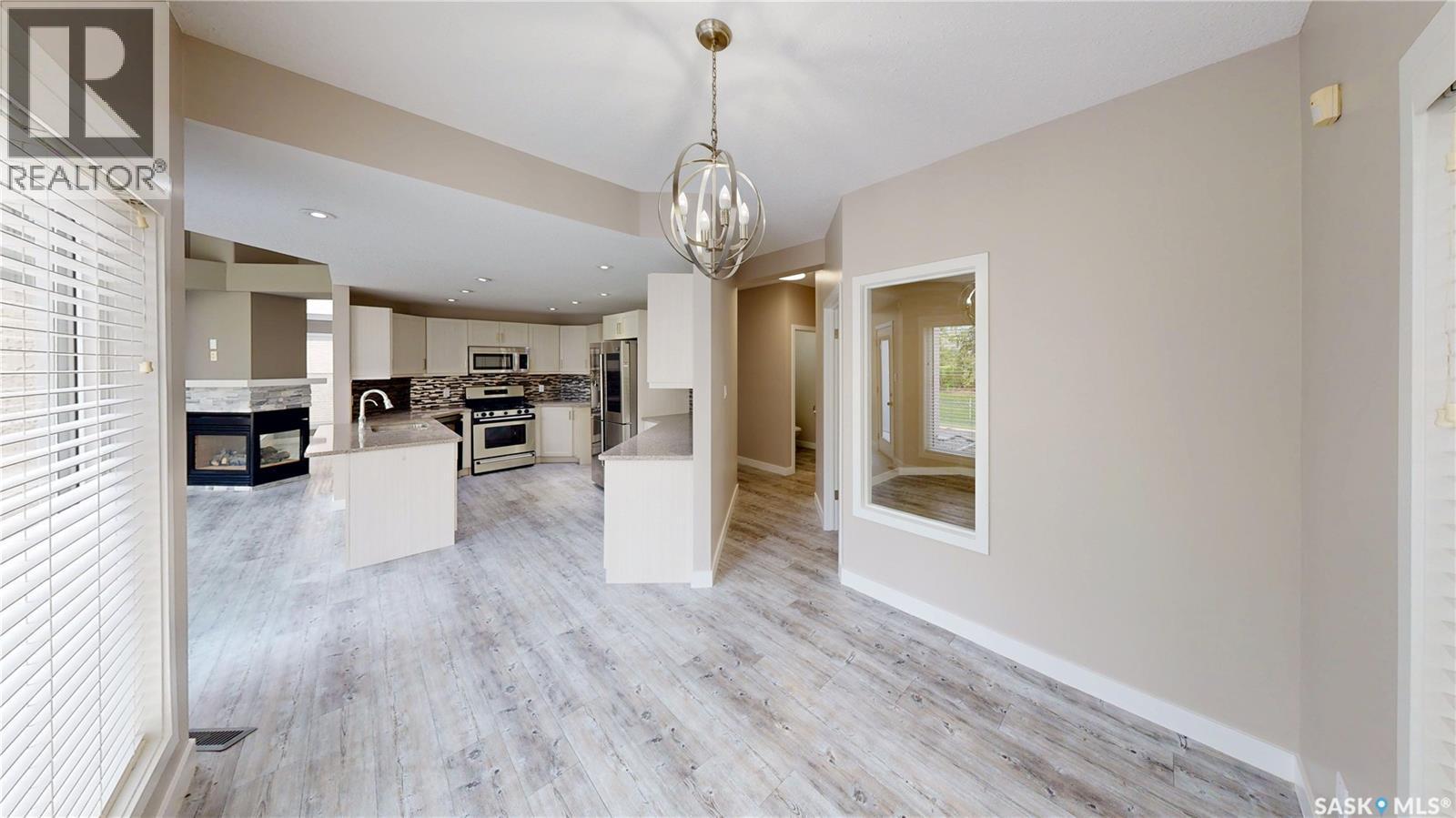 5006 Wascana Vista Court, Regina, SK - Indoor Photo Showing Other Room With Fireplace