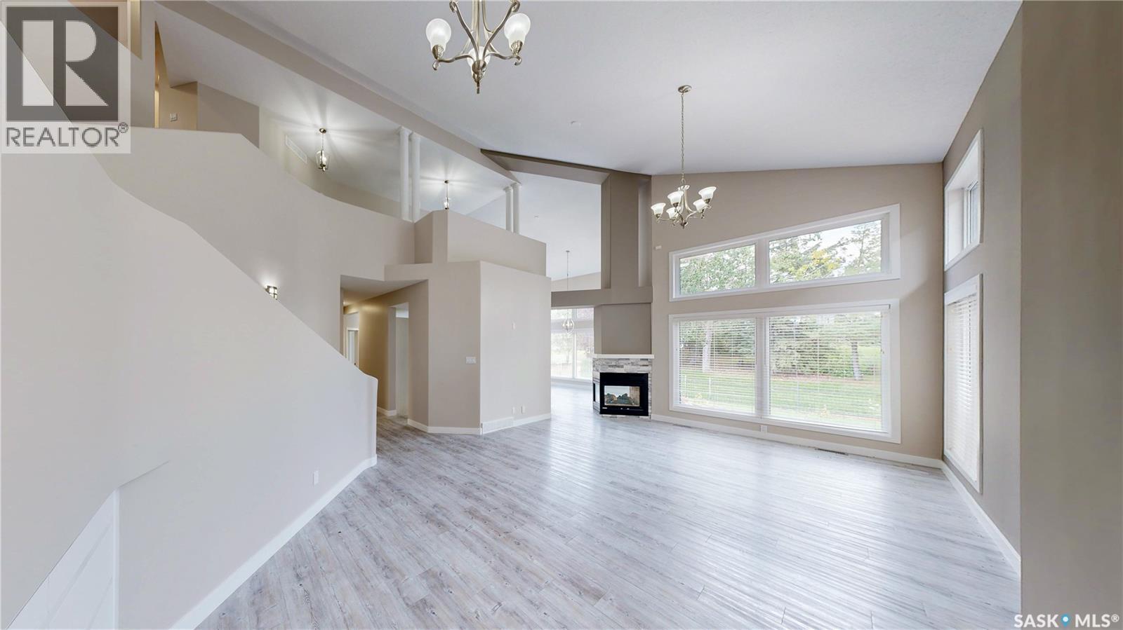 5006 Wascana Vista Court, Regina, SK - Indoor Photo Showing Other Room With Fireplace