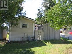 Rearview of mobile home and shed -