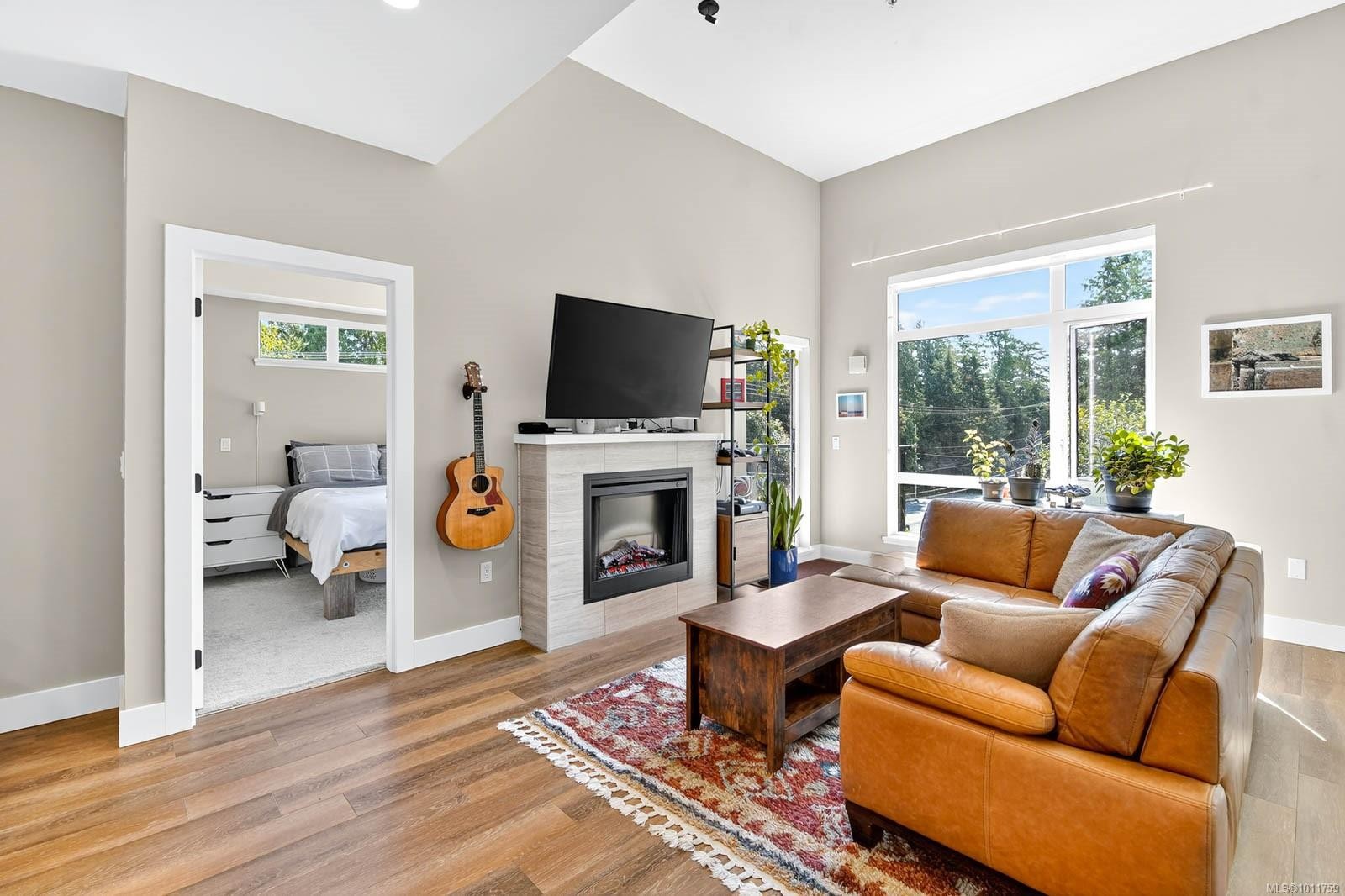 302-700 Yew Wood Rd, Tofino, BC - Indoor Photo Showing Living Room With Fireplace