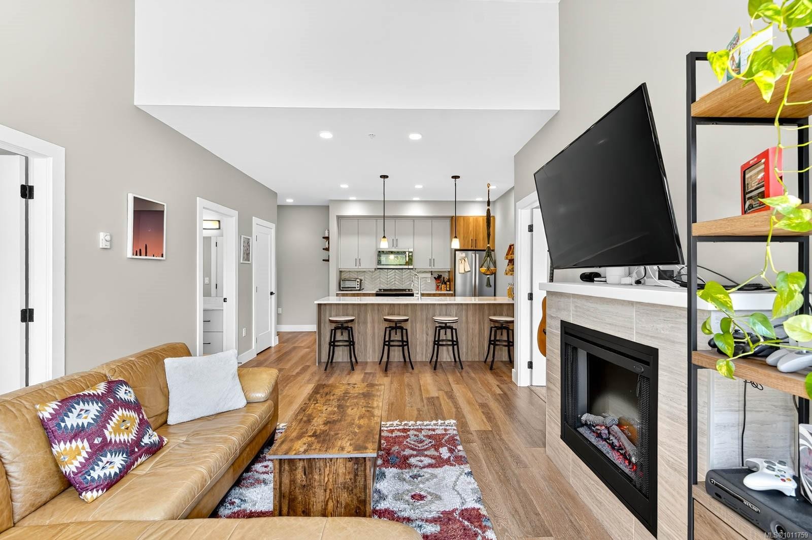302-700 Yew Wood Rd, Tofino, BC - Indoor Photo Showing Living Room With Fireplace