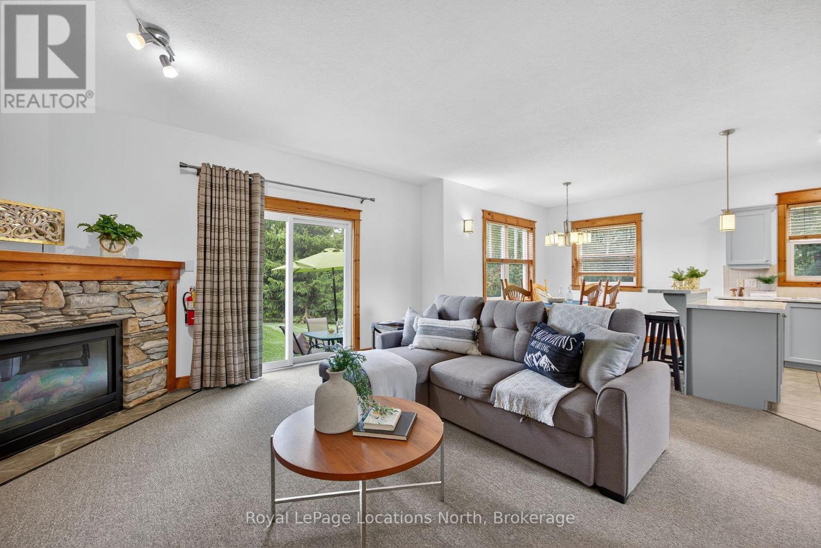 121 - 170 Snowbridge Way, Blue Mountains, ON - Indoor Photo Showing Living Room With Fireplace