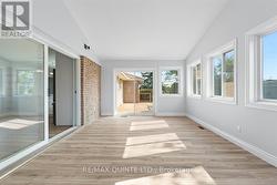 large sunroom with doors to new deck -