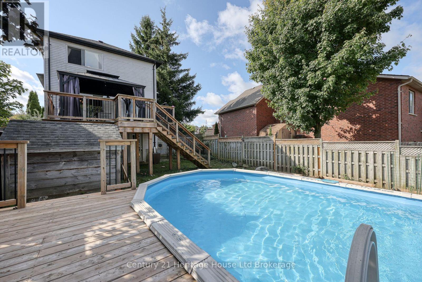 60 Canrobert Street, Woodstock (Woodstock - South), ON - Outdoor With Above Ground Pool With Deck Patio Veranda