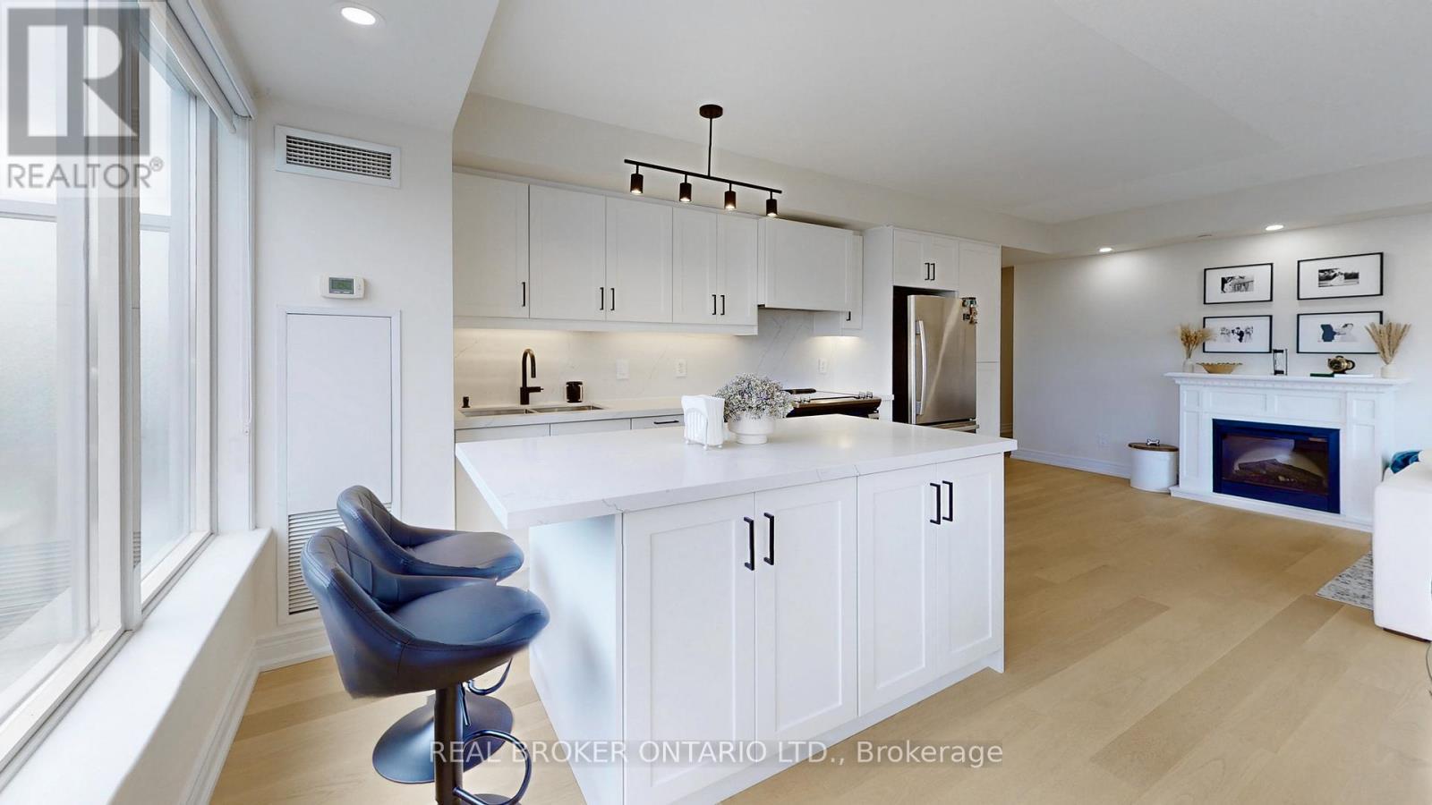 415 - 701 Sheppard Avenue W, Toronto, ON - Indoor Photo Showing Kitchen With Fireplace
