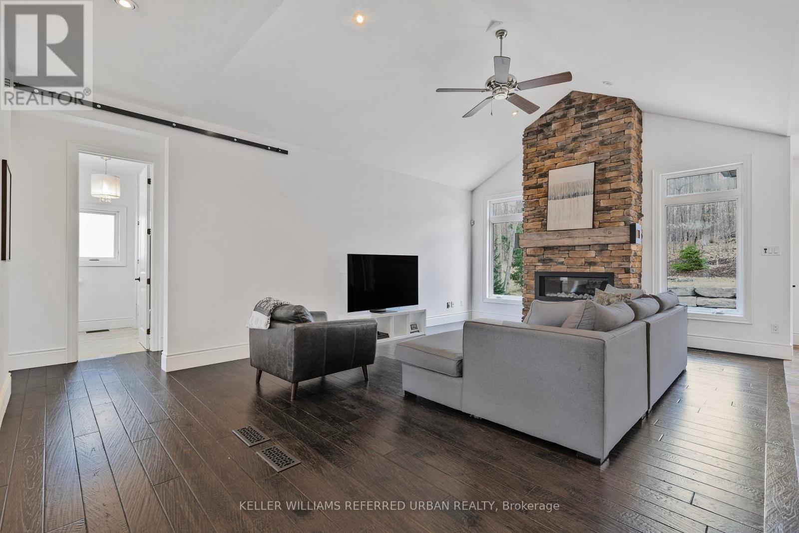 25 Heron Boulevard, Springwater, ON - Indoor Photo Showing Living Room With Fireplace