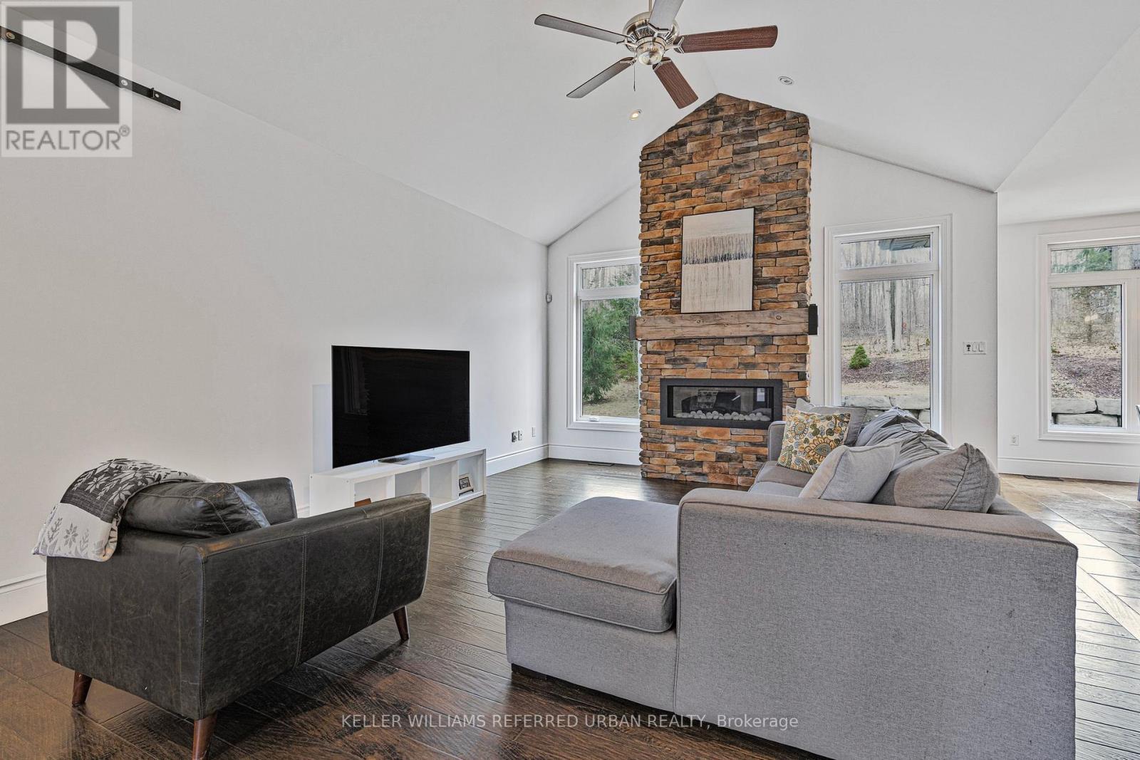 25 Heron Boulevard, Springwater, ON - Indoor Photo Showing Living Room With Fireplace