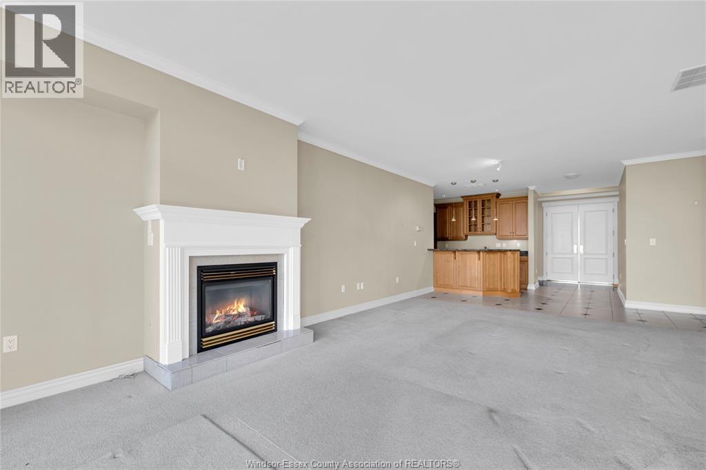 4955 Riverside Drive East Unit# 802, Windsor, ON - Indoor Photo Showing Other Room With Fireplace