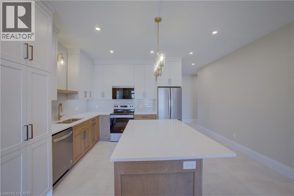 91 Bedell Drive, Drayton, ON - Indoor Photo Showing Kitchen With Double Sink With Upgraded Kitchen