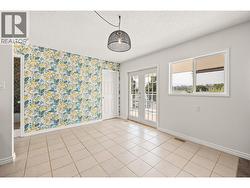 Balcony access off of kitchen and stairs to lower level laundry room/inlaw suite access -