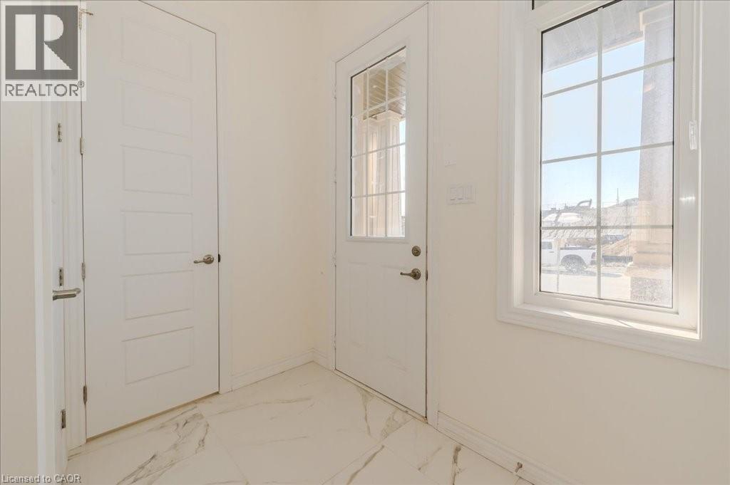 Doorway featuring plenty of natural light and marble finish flooring - 35 Hitchman Street, Paris, ON - Indoor Photo Showing Other Room
