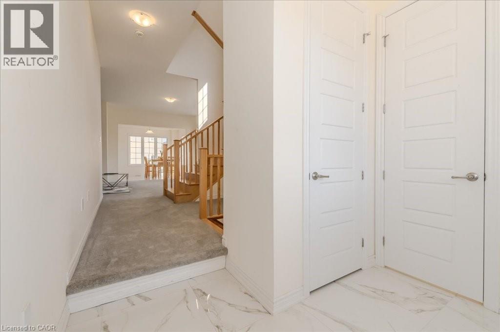 Hall featuring light marble finish flooring and stairs - 35 Hitchman Street, Paris, ON - Indoor Photo Showing Other Room
