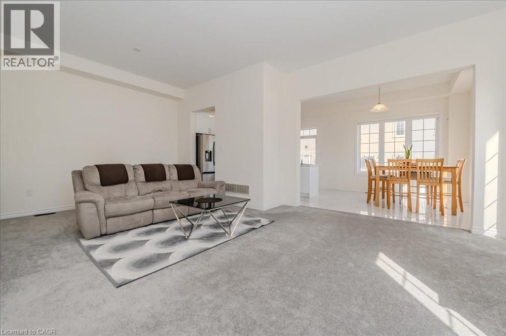 Carpeted living area featuring baseboards - 35 Hitchman Street, Paris, ON - Indoor Photo Showing Living Room