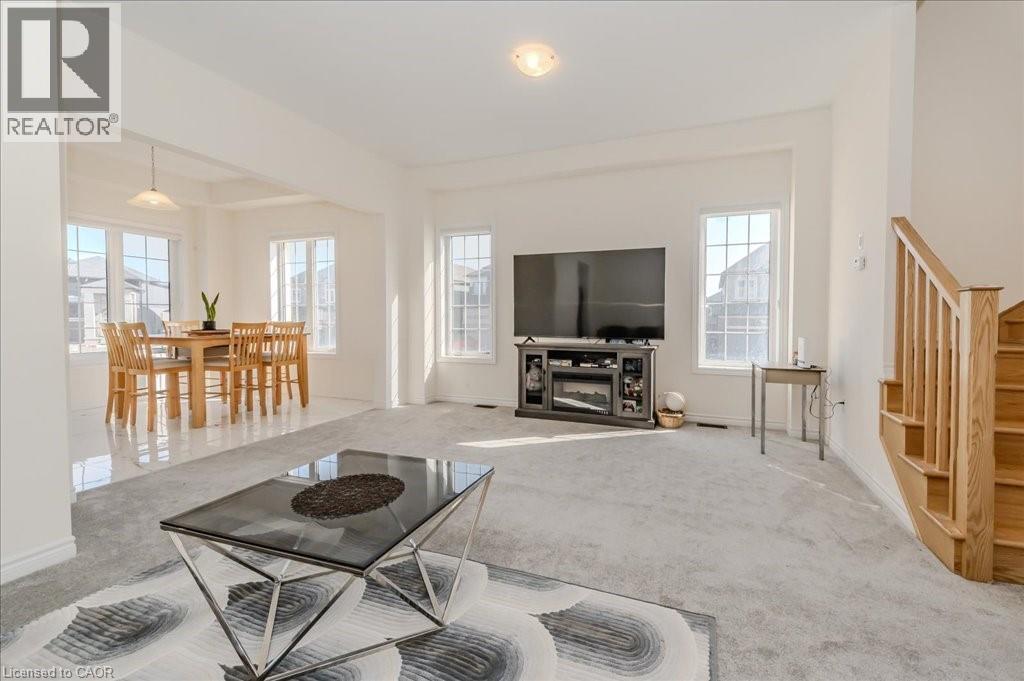 Carpeted living area with stairway and baseboards - 35 Hitchman Street, Paris, ON - Indoor Photo Showing Living Room