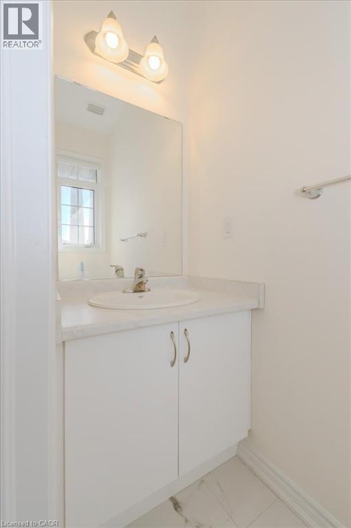 Bathroom with vanity and light marble finish flooring - 35 Hitchman Street, Paris, ON - Indoor Photo Showing Bathroom