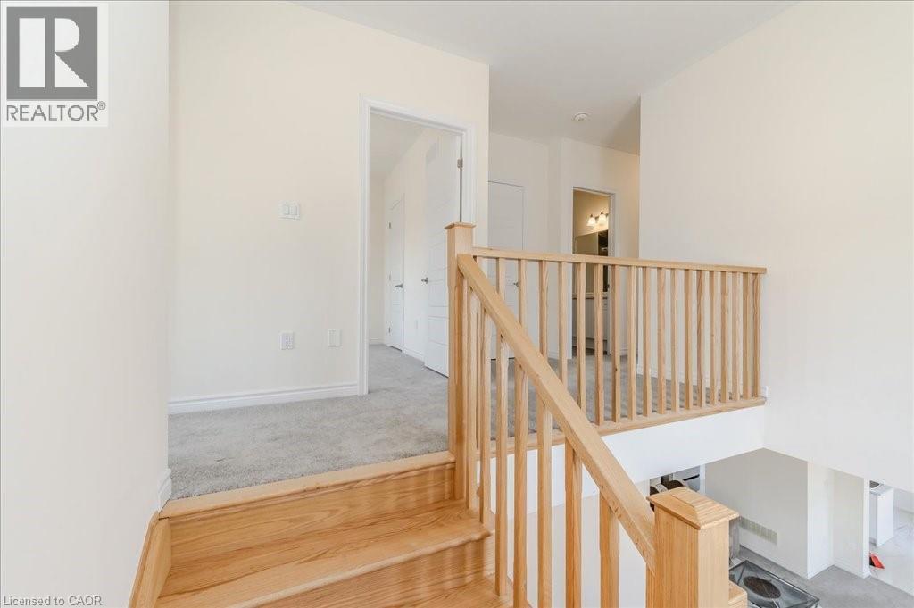 Stairs featuring carpet floors and baseboards - 35 Hitchman Street, Paris, ON - Indoor Photo Showing Other Room